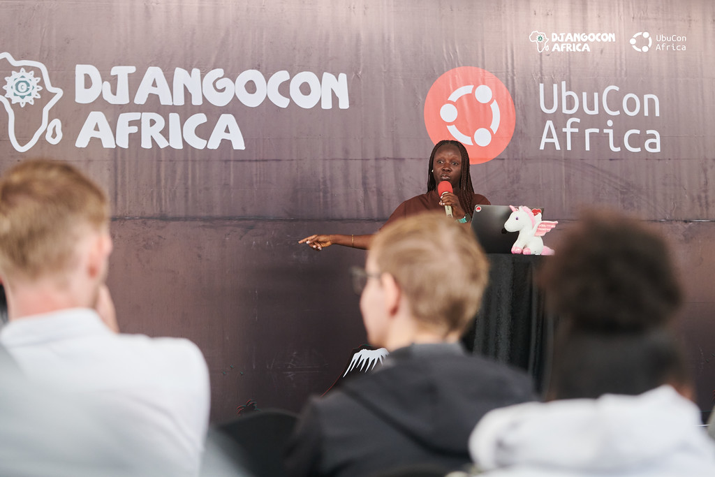 Theresa Seyram Agbenyegah presenting to an audience at DjangoCon Africa and UbuCon Africa.