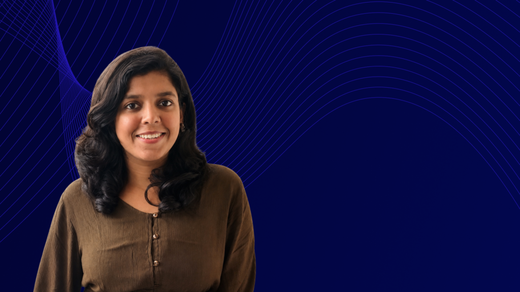 Portrait of a smiling woman with long dark hair against a dark blue background featuring flowing purple lines.
