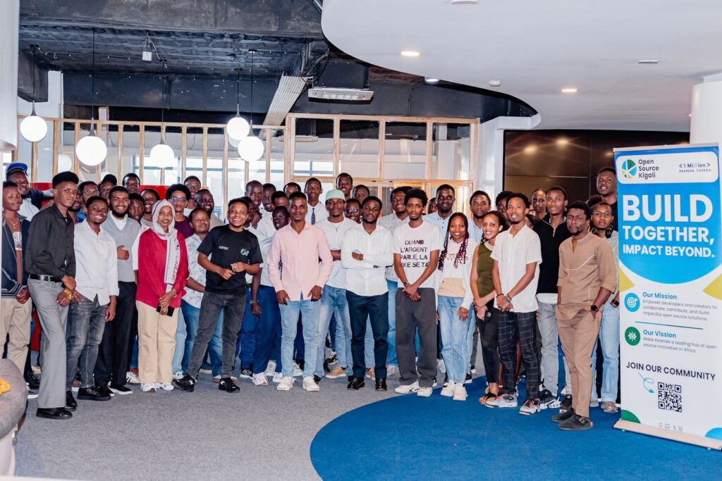 A group of people in a room at Open Source Kigali, facing the camera